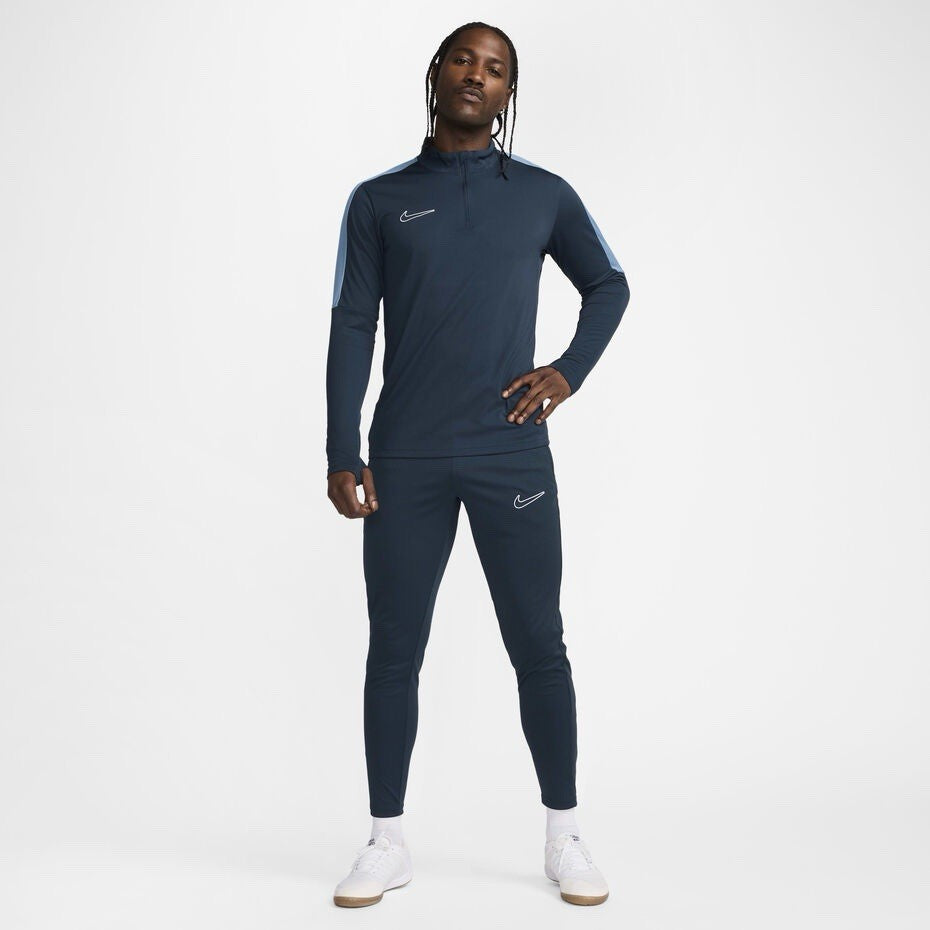 Nike blue Dri-FIT 1/4 zip top with logo and breathable material.