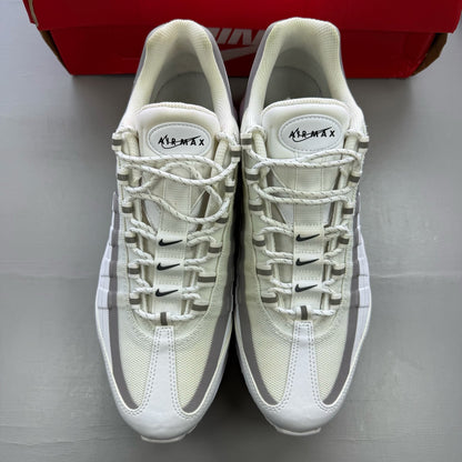 Nike Air Max 95 Ultra white trainers with reflective details and signature logo.