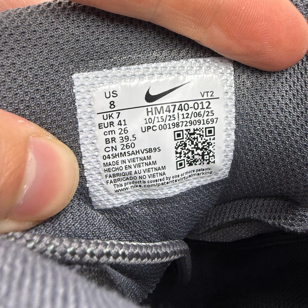 Nike Air Max 95 grey trainers with big bubble sole and logo detailing.