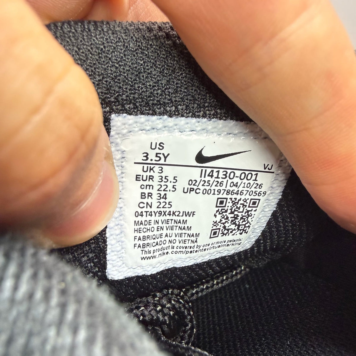 Nike Air Max 95 black trainers with big bubble sole and logo detail.