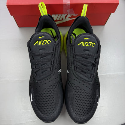 Nike Air Max 270 black trainers with neon volt accents and white sole.