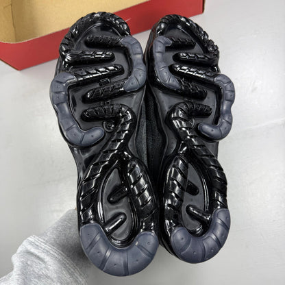 Nike Air VaporMax 2023 black Flyknit sneakers with visible logo and sleek design.