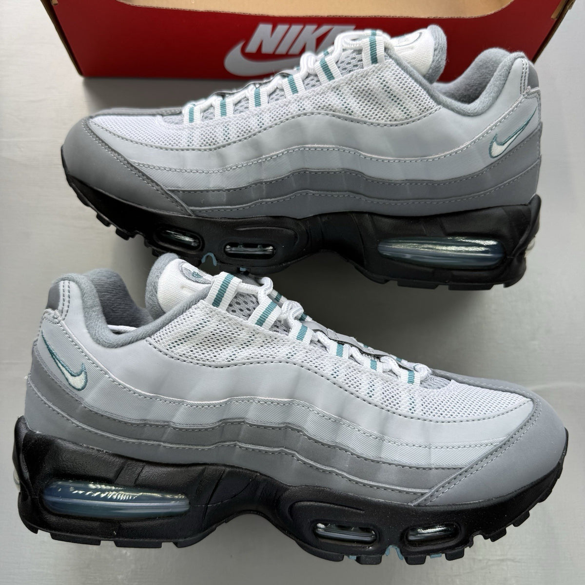 Nike Air Max 95 OG trainers grey with teal accents and big bubble sole.