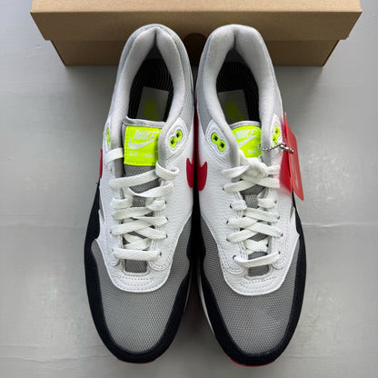 Nike trainers white with chili volt and red accents, featuring iconic swoosh logo.
