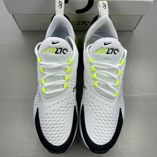 Nike Air Max 270 black trainers with white and volt green accents, mesh material.