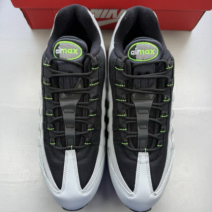 Nike Air Max 95 trainers black with grey and green accents, featuring signature logo.
