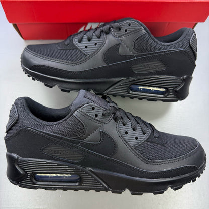 Nike Air Max 90 trainers black with signature logo and sleek design.