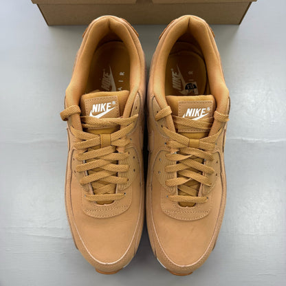 Nike Air Max 90 brown trainers with premium suede material and iconic swoosh logo.