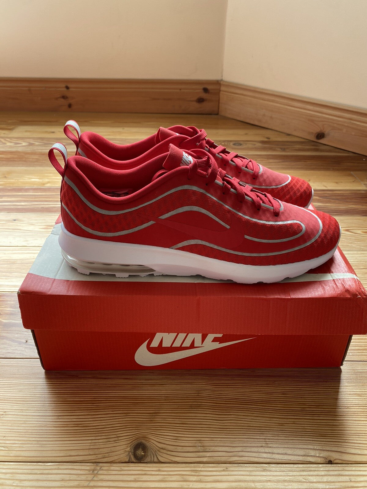 Nike Air Max Mercurial 98 trainers university red with white accents and signature logo.