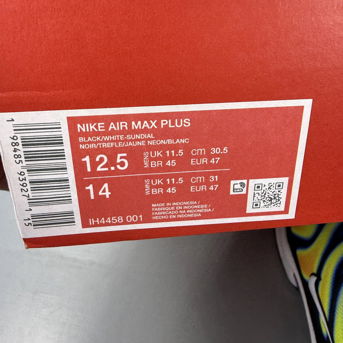 Nike trainers black with yellow heat map pattern and signature swoosh logo.