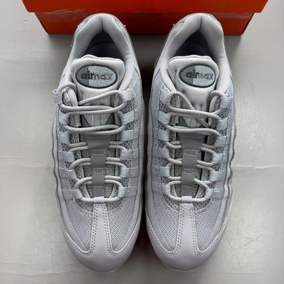 Nike grey deck shoes with big bubble sole and classic logo detail.