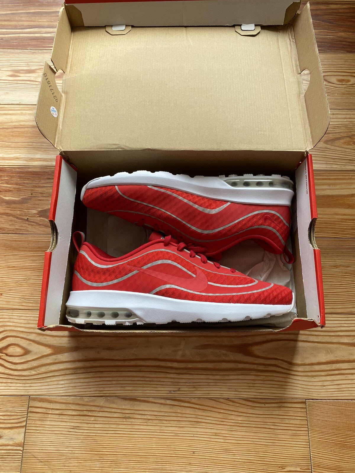 Nike Air Max Mercurial 98 trainers university red with white accents and signature logo.