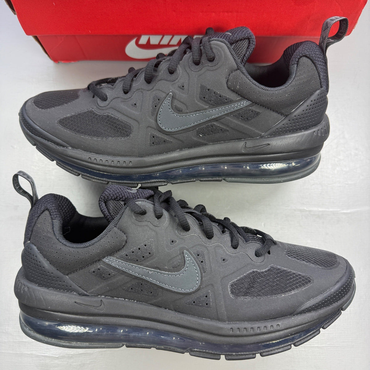 Nike trainers black with sleek design and Air Max cushioning.