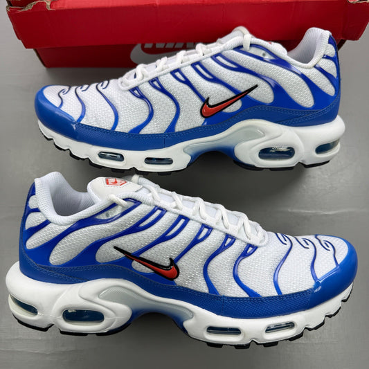 Nike trainers white with signal blue accents and distinctive Air Max Plus design.