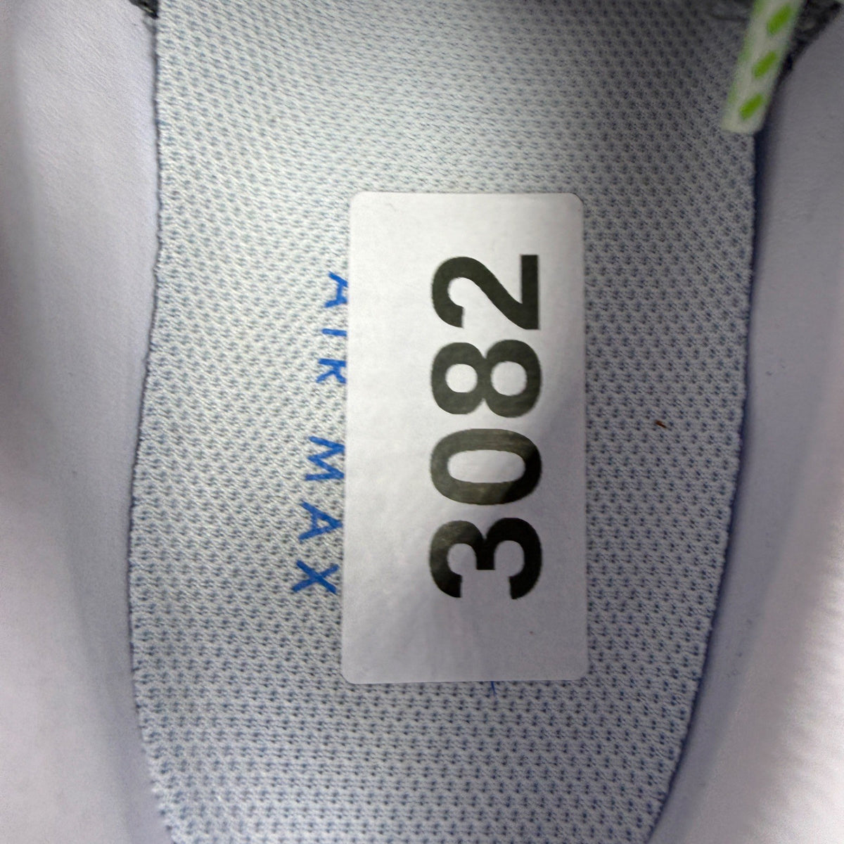 Nike Air Max 95 green trainers with big bubble design and blue accents.