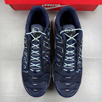 Nike blue deck shoes with logo detail and sleek design.