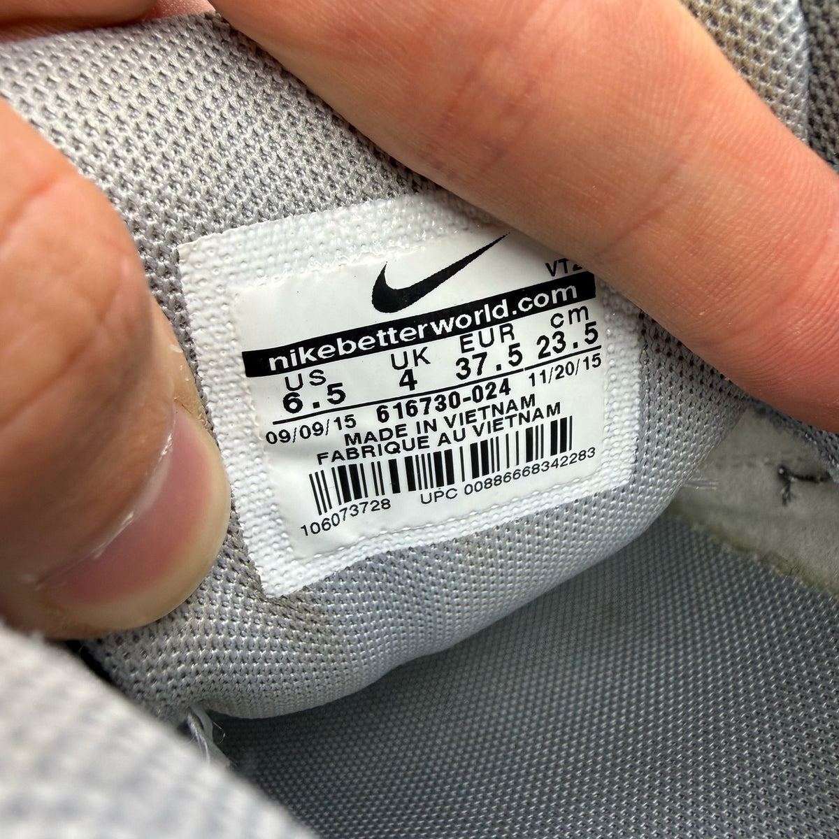 Nike Air Max 90 grey trainers with gum sole and iconic swoosh logo.
