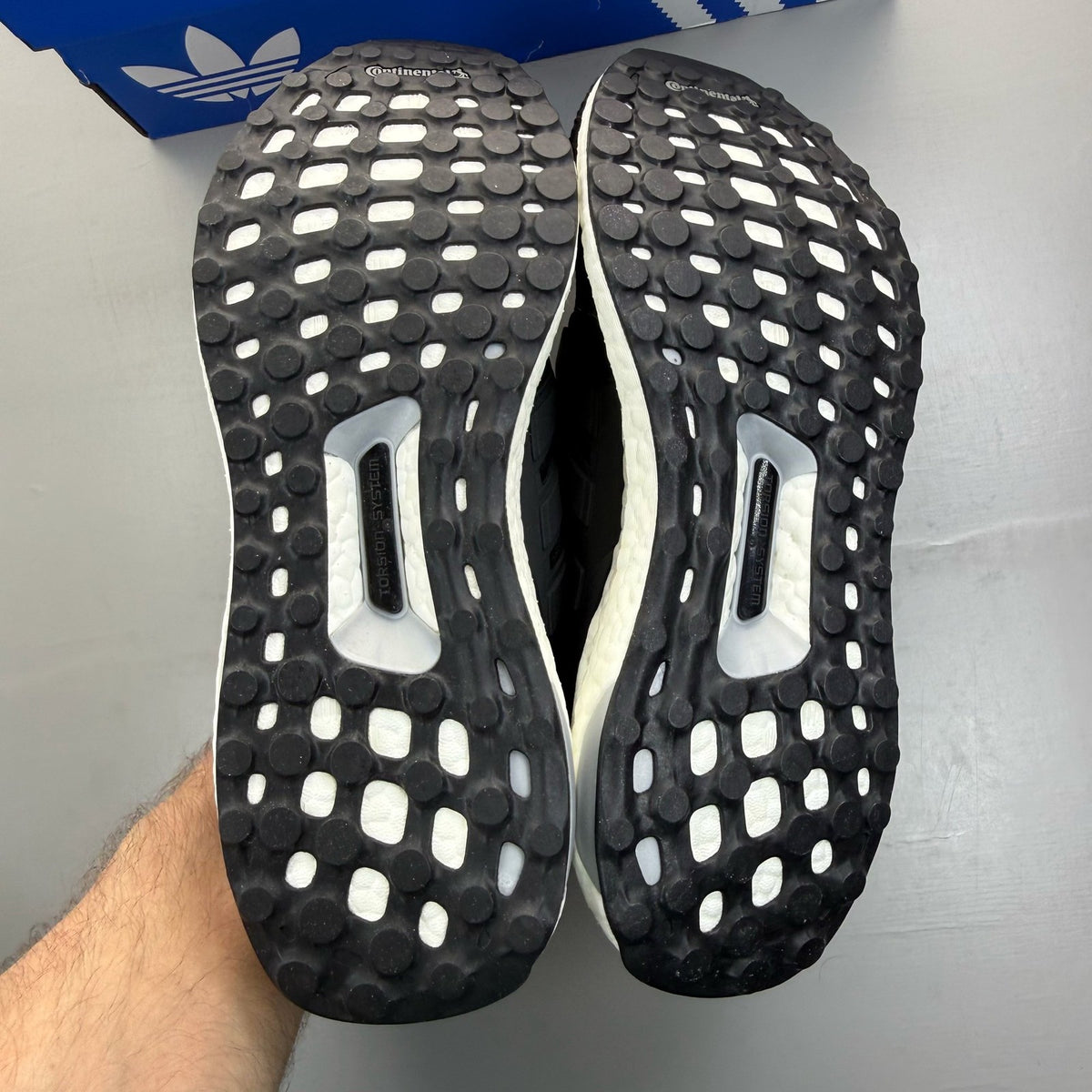 Adidas Ultra Boost 4.0 black running trainers with white accents and logo detail.