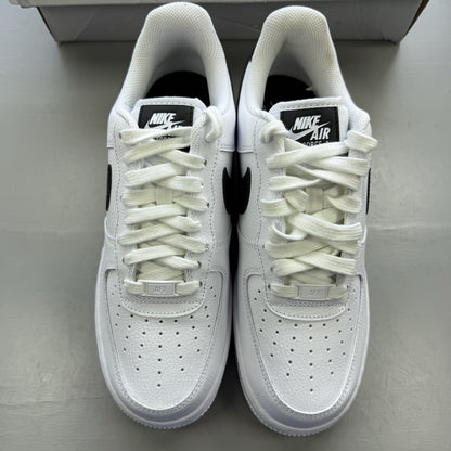 Nike Air Force 1 Low trainers white with black swoosh logo and leather upper.