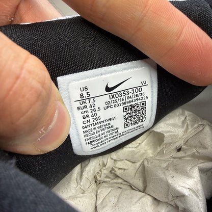 Nike white trainers with light armoury blue and black accents, featuring logo details.