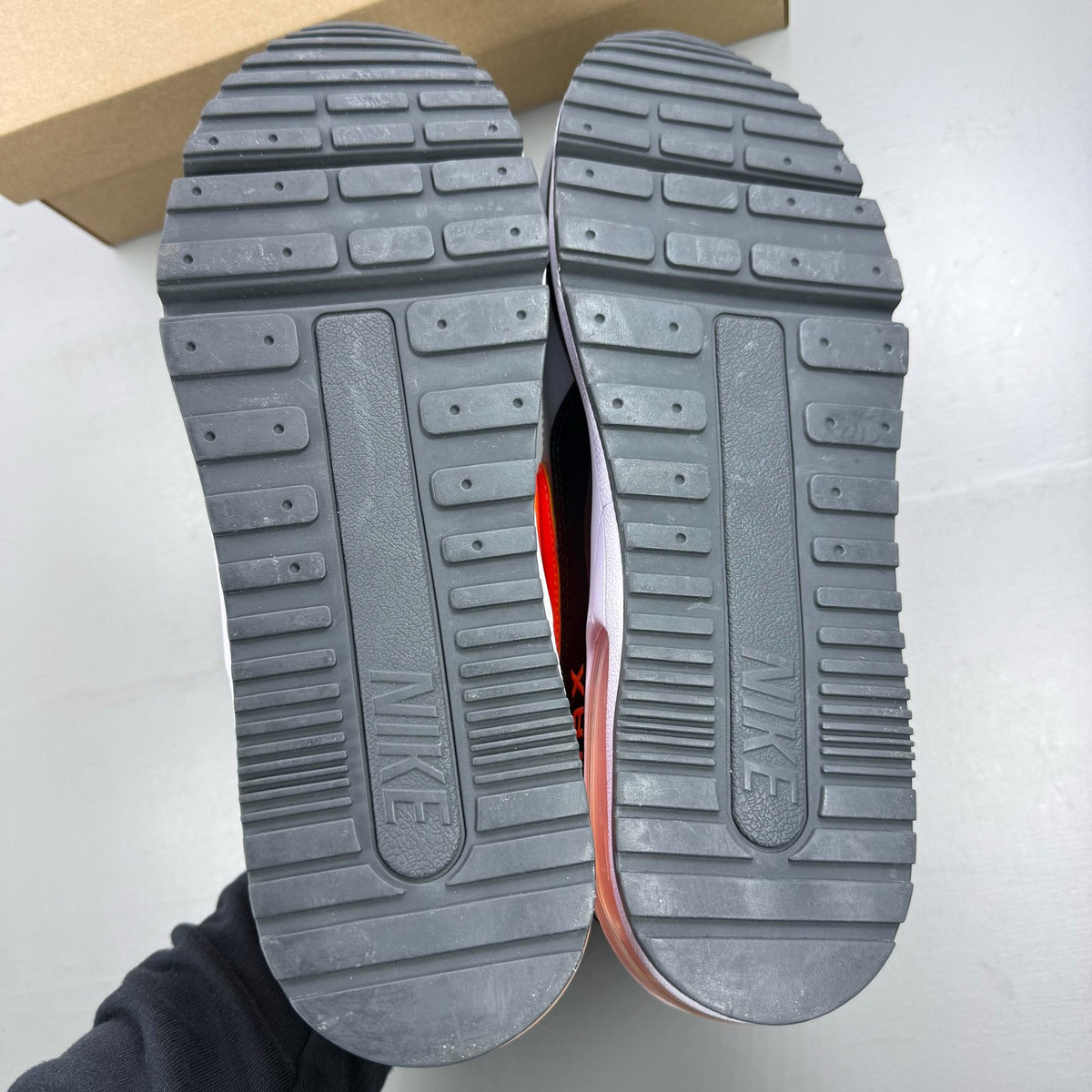 Nike Air Max LTD 3 grey trainers with total orange accents and logo detail.