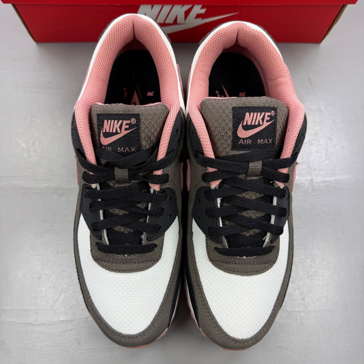 Nike deck shoes red with white accents and logo, featuring a sleek design.