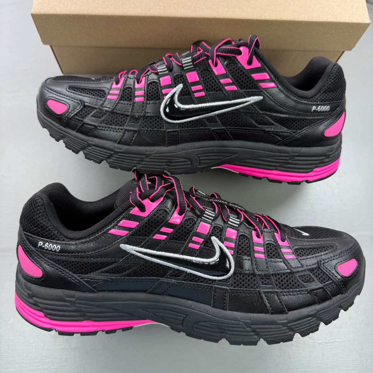 Nike P-6000 trainers black pink metallic detailing and logo accents.