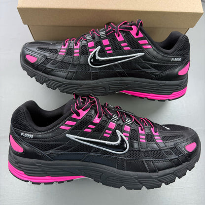 Nike P-6000 trainers black pink metallic detailing and logo accents.