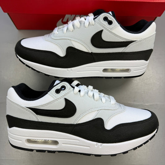 Nike trainers white with black and platinum grey accents, featuring iconic swoosh logo.