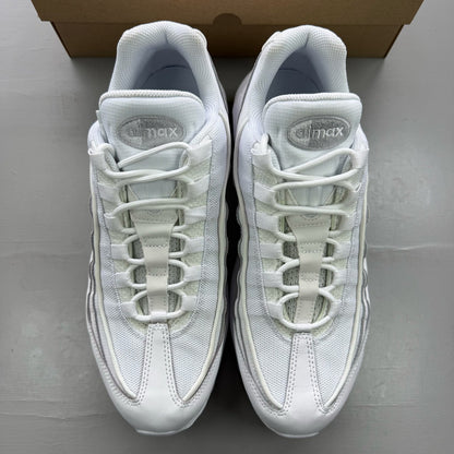Nike Air Max 95 white trainers with mesh and leather upper, reflective accents.