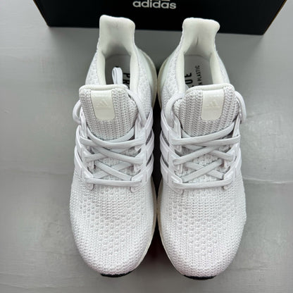 Adidas Ultra Boost 4.0 DNA white trainers with black accents and signature three-stripe logo.
