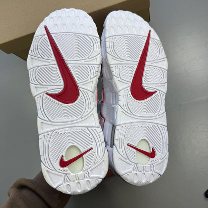 Nike athletic shoes white with varsity red accents and bold "AIR" lettering.