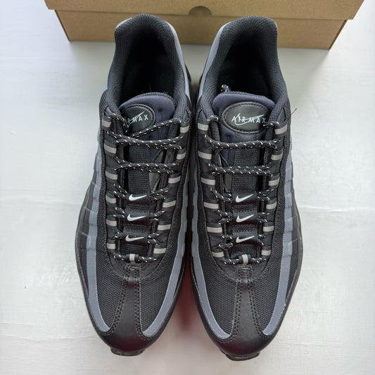 Nike black Air Max 95 trainers with reflective details and logo.