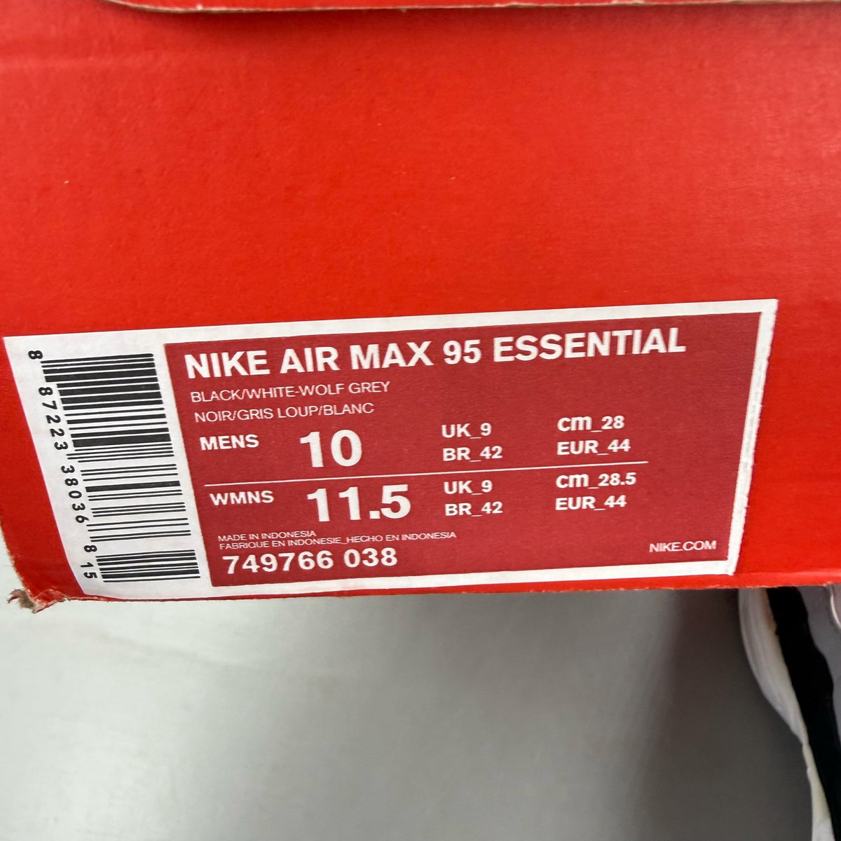 Nike Air Max 95 black trainers with grey and white accents, featuring iconic logo.