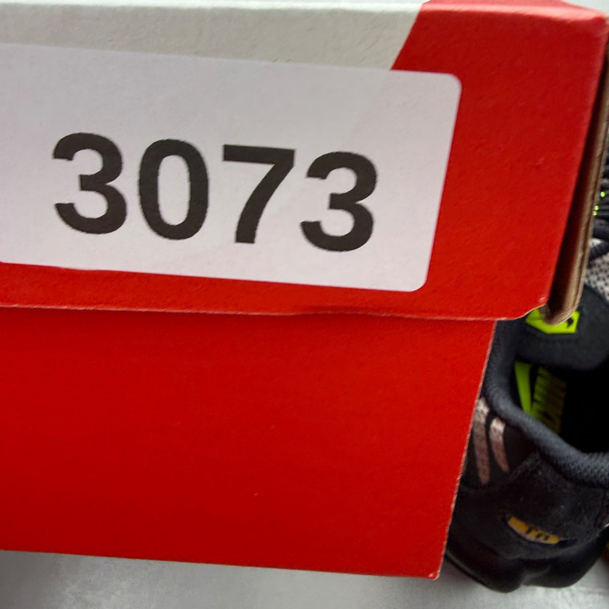Nike Air Max Plus TN black grey volt with signature logo and sleek design.
