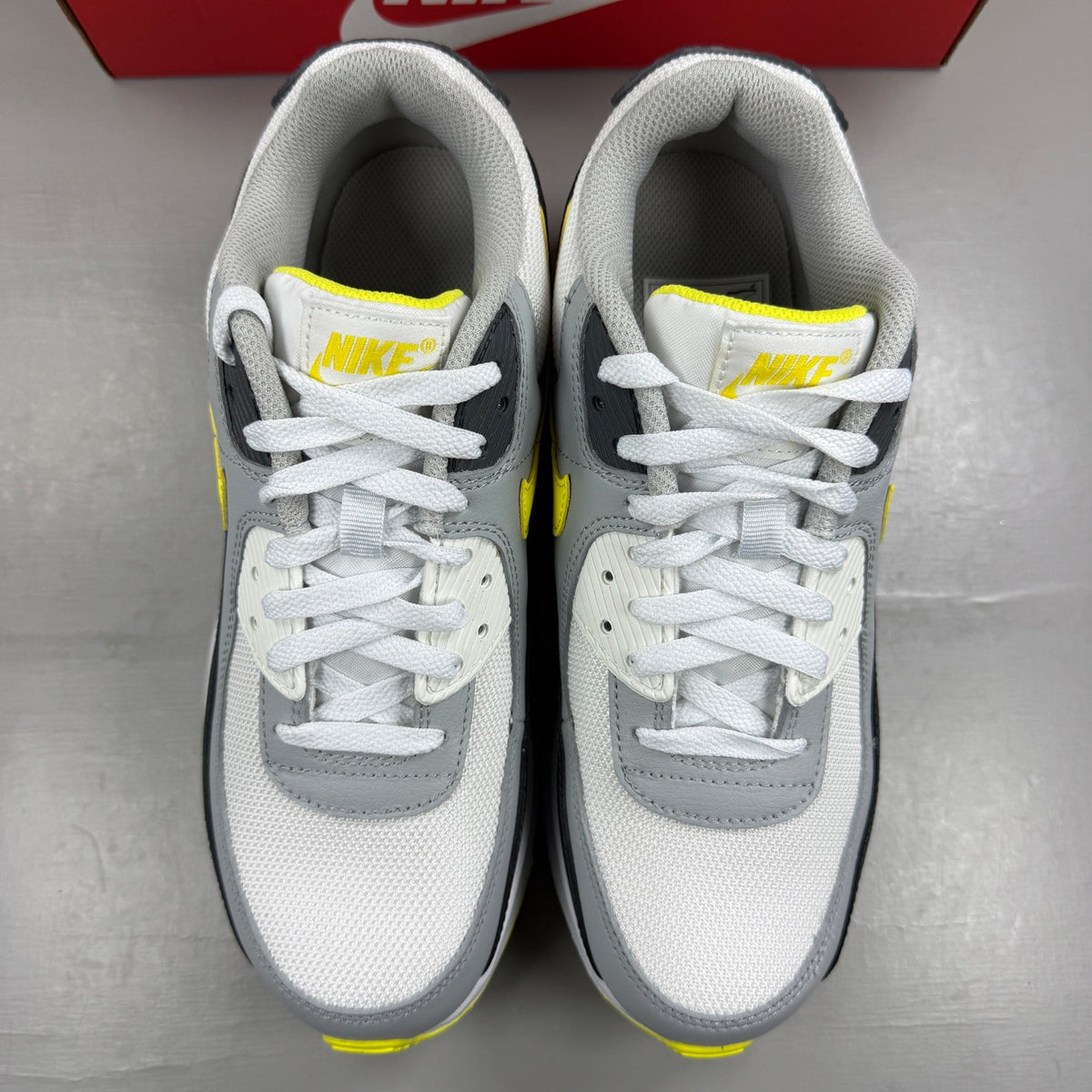 Nike deck shoes grey with sonic yellow accents and white sole.
