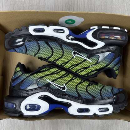 Nike Air Max Plus TN trainers black with racer blue and volt accents, mesh material.