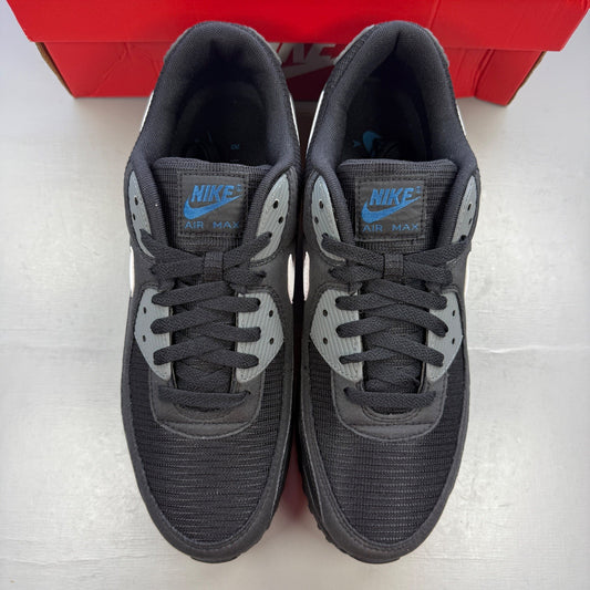 Nike running shoes black with grey accents and logo on the side.