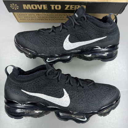 Nike black Air VaporMax trainers with Flyknit upper and signature swoosh logo.