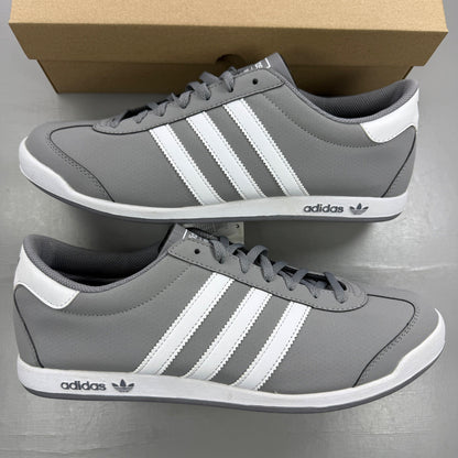 Adidas grey deck shoes with white accents and classic logo detailing.