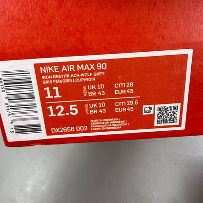 Nike Air Max 90 grey trainers with jewel accents and textured upper.