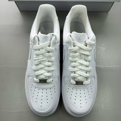 Nike Air Force 1 '07 white trainers with classic silhouette and embossed logo.