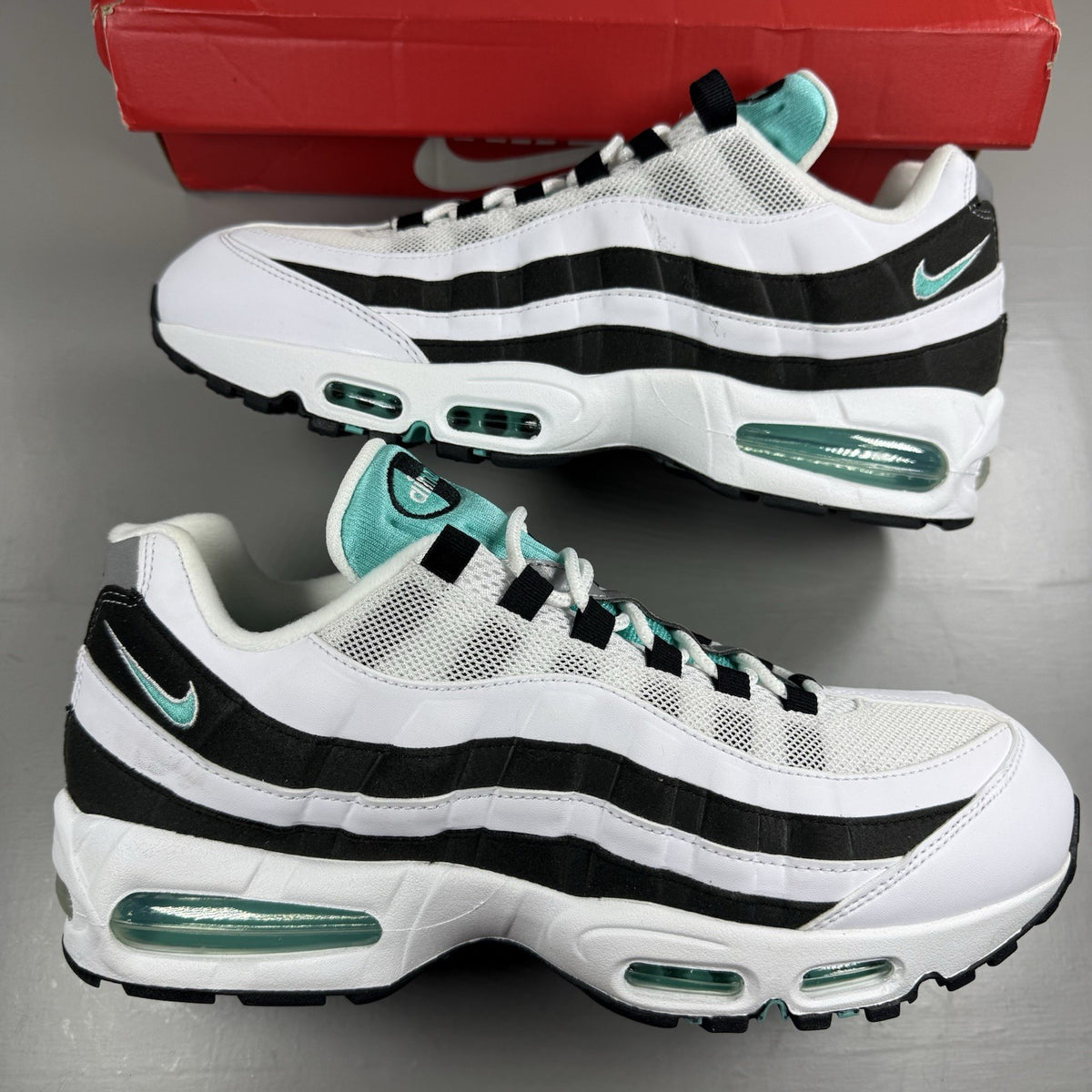 Nike Air Max 95 OG trainers white with black accents and signature bubble sole design.