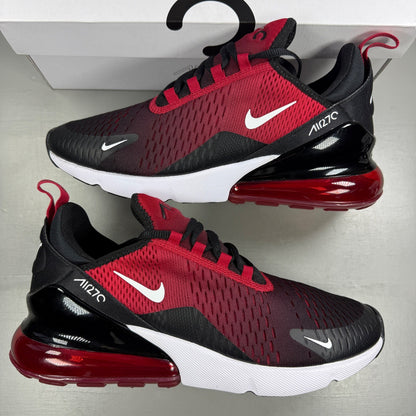 Nike trainers red with black and white accents, featuring Air Max cushioning and logo.