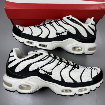 Nike Air Max Plus TN trainers white with black accents and signature logo details.