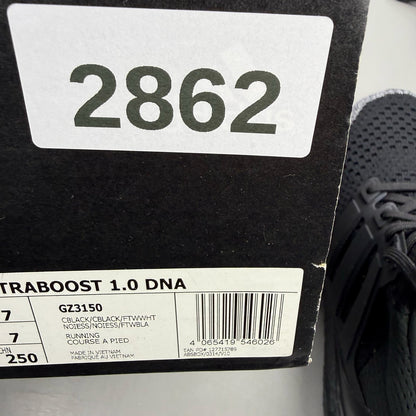 Adidas black Ultra Boost 1.0 trainers with core black and oreo toe design.