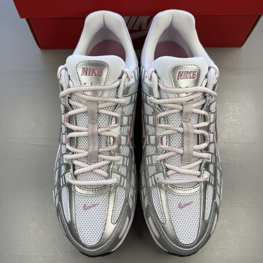 Nike P-6000 white trainers with elemental pink and silver accents, featuring logo details.