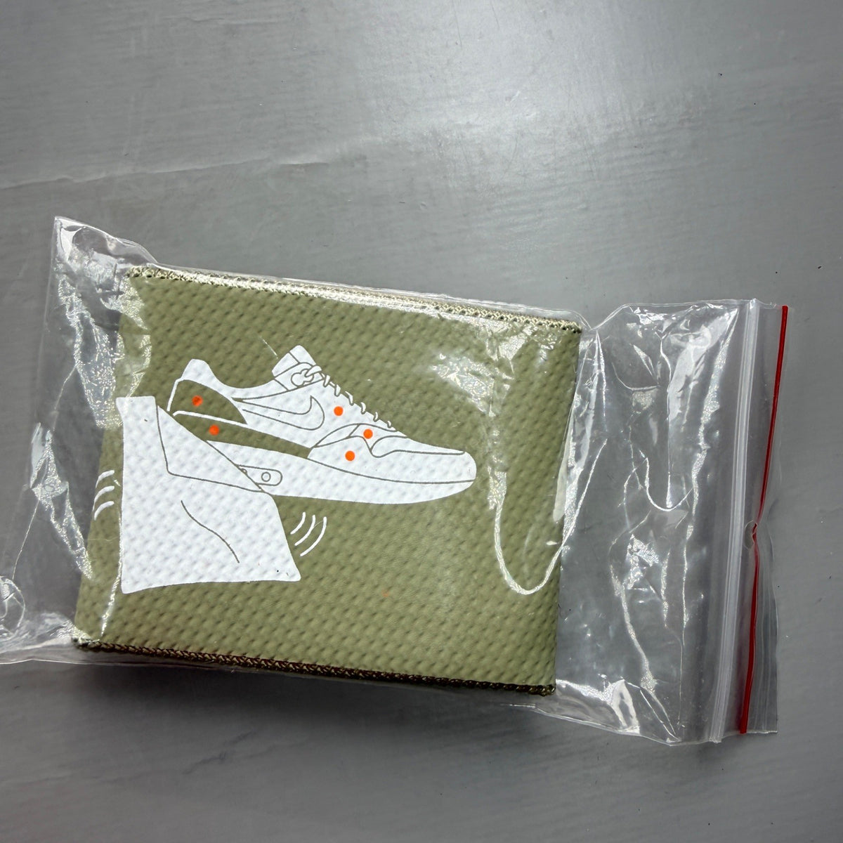 Nike Air Max 1 white trainers with rubberized details and classic logo design.