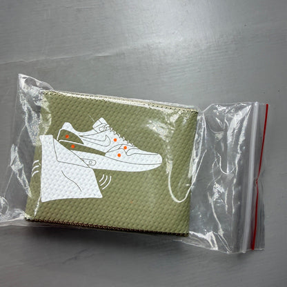 Nike Air Max 1 white trainers with rubberized details and classic logo design.