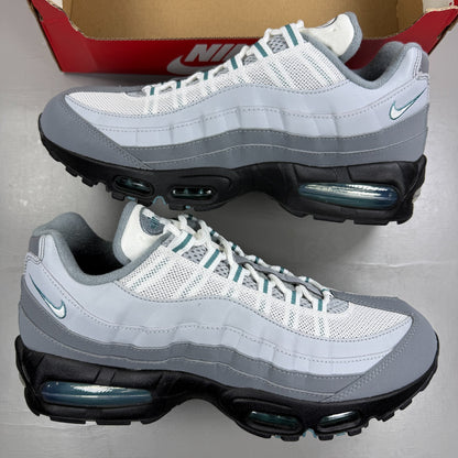Nike running shoes grey with big bubble sole and reflective detailing.